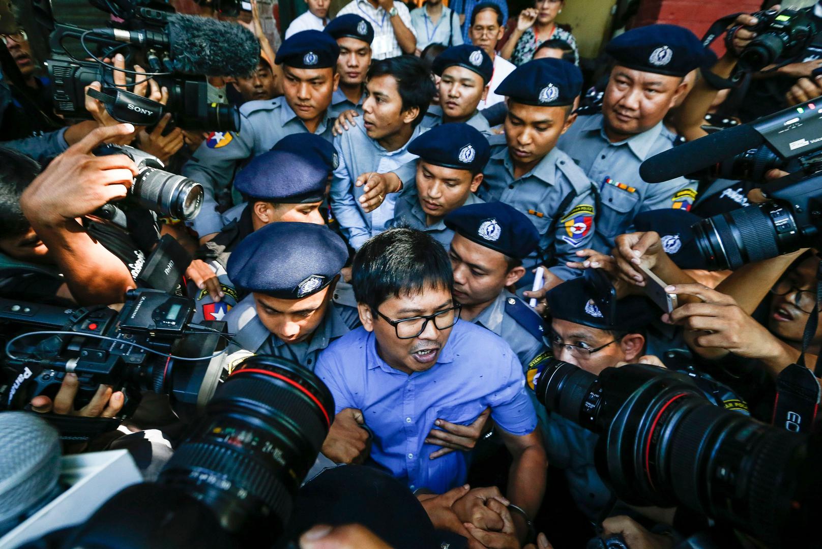 Reuters journalists Wa Lone and Kyaw Soe Oo are escorted by police as they leave the courthouse after a hearing in Yangon, Myanmar, January 10, 2018.
