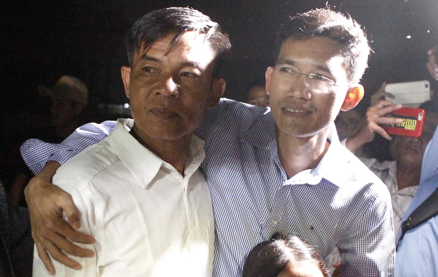 Former Radio Free Asia journalists Uon Chhin and Yeang Sothearin outside Prey Sar prison in Phnom Penh, Cambodia, August 21, 2018.