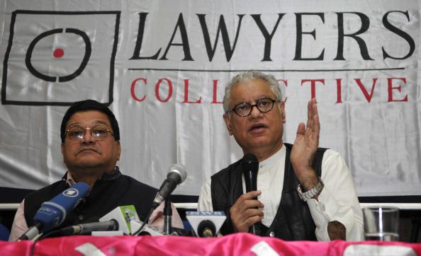Lawyers Collective co-founder Anand Grover (right) speaks with the media after the Supreme Court's verdict on section 377 of the Indian Penal Code, December 11, 2013, in New Delhi. 