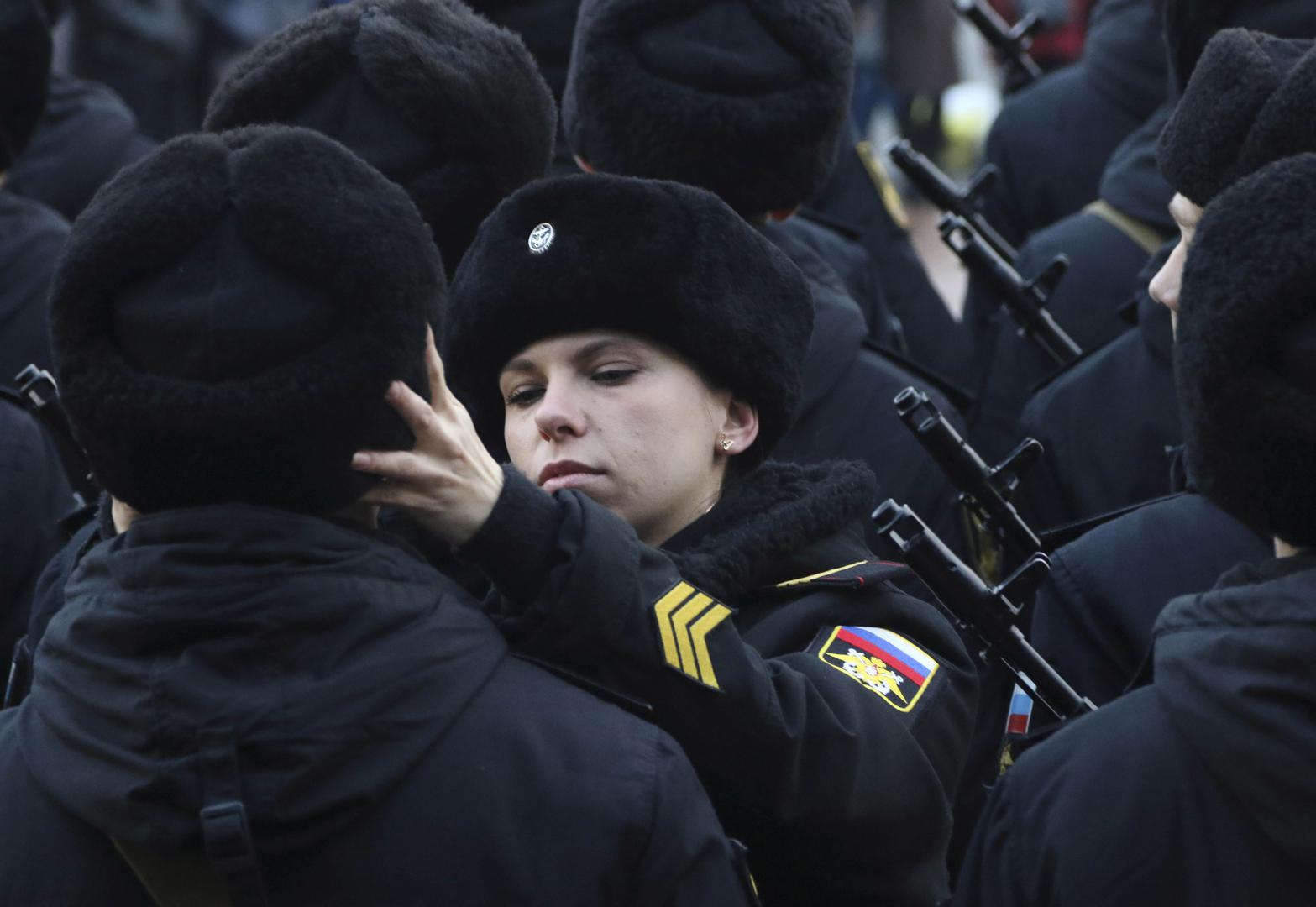 A Russian Marine Corps sergeant adjusts the hat of a conscript during an oath-taking ceremony in the Black Sea port of Sevastopol.
