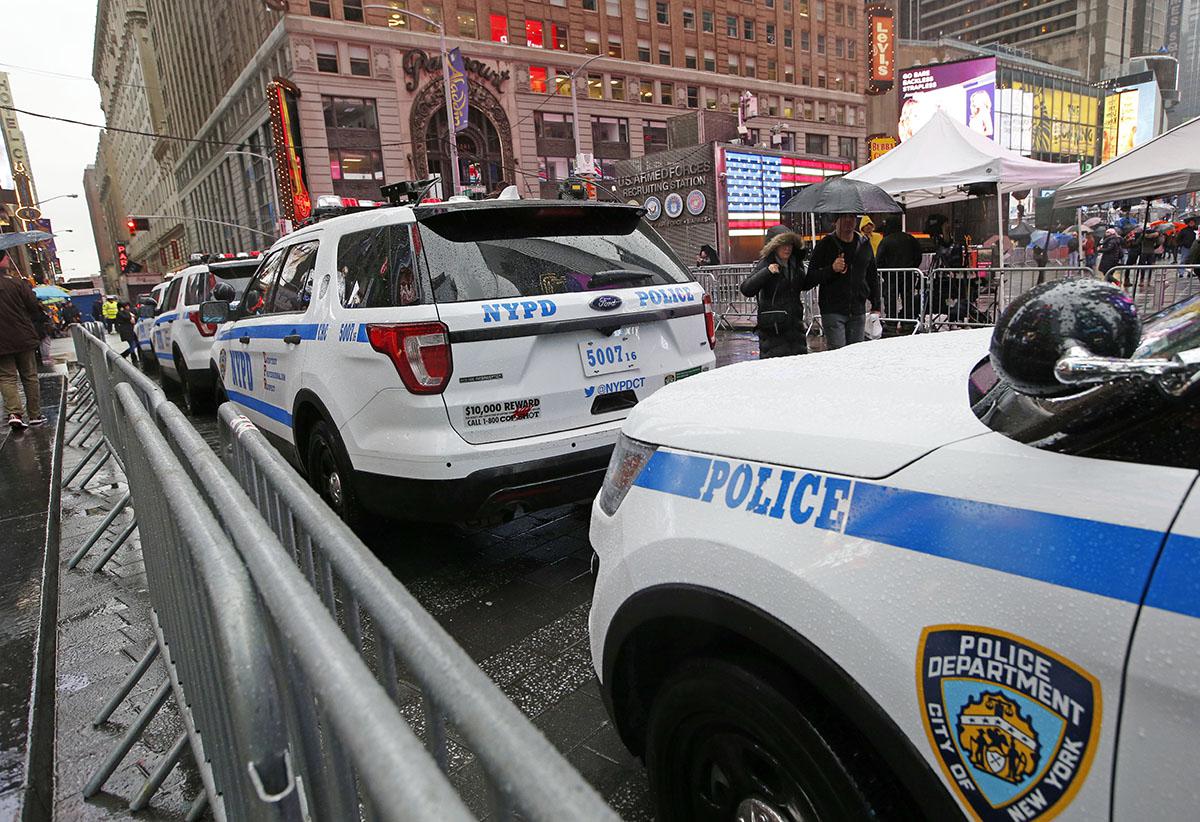 A line of police cars are parked along a street in Times Square, in New York, December 29, 2016.