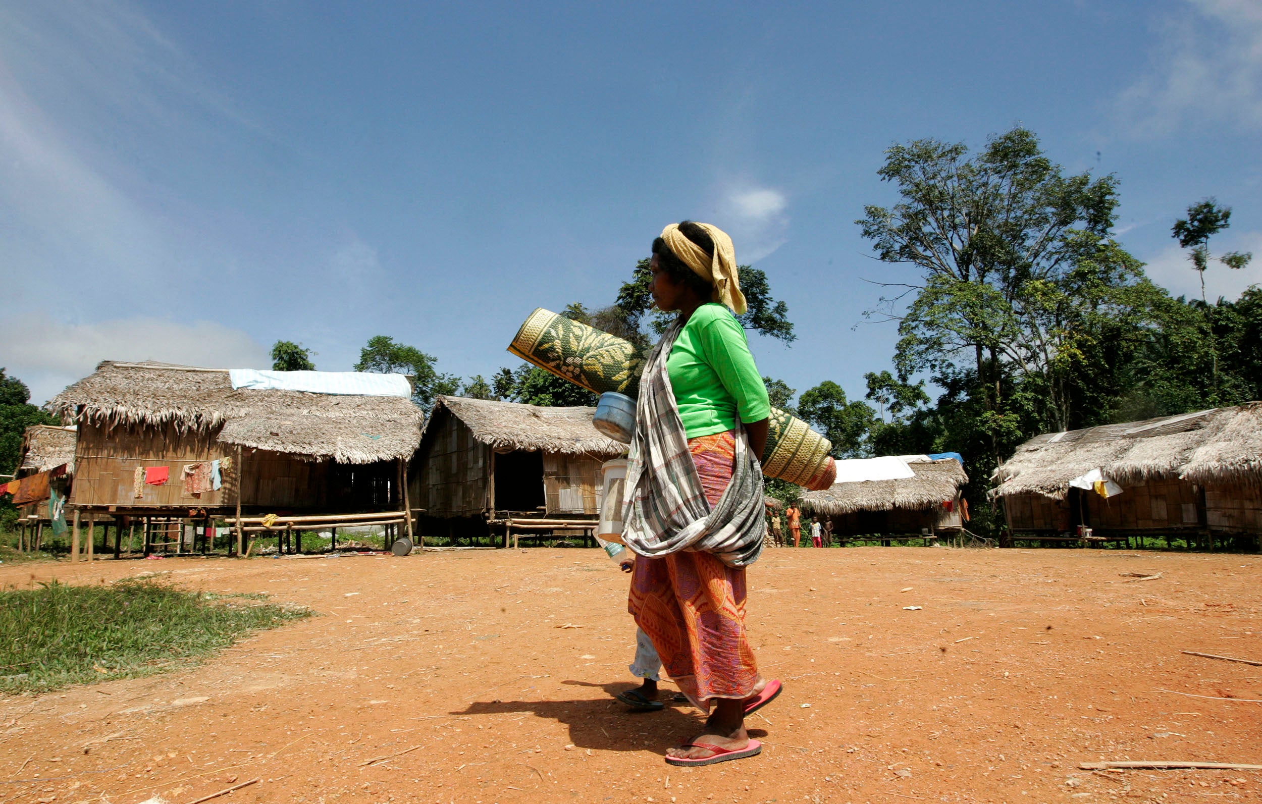 A Batek woman walks near her village in Kuala Koh, Kelantan, Malaysia.