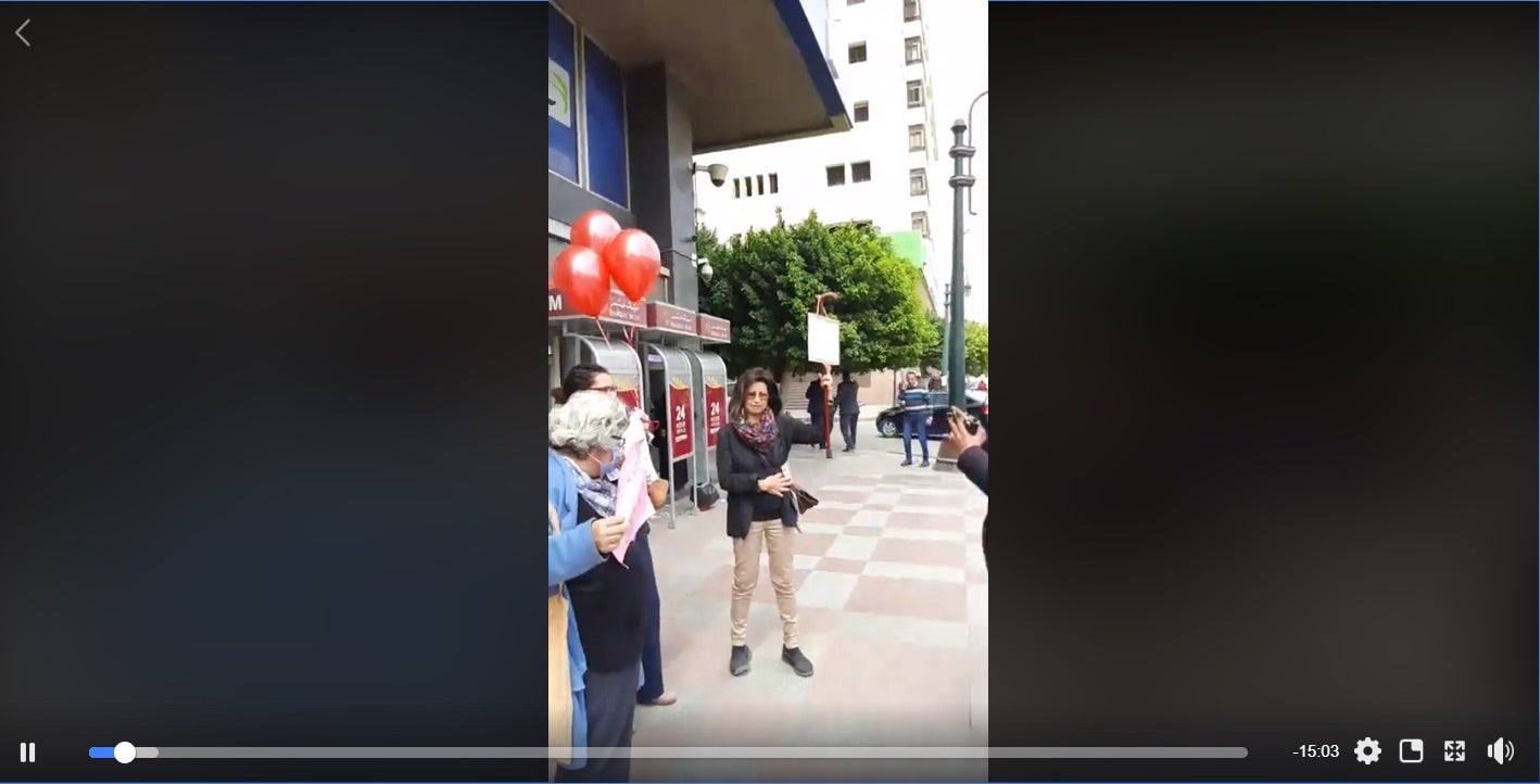 Screenshot of a live stream video from the protest showing Ahdaf Soueif, right, Laila Soueif, left, and Rabab al-Mahdy in between before they were arrested at the protest in downtown Cairo on March 18.
