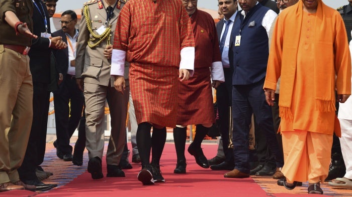  Bhutan's King Jigme Khesar Namgyel Wangchuck (L) with Yogi Adityanath (R), Chief Minister of India's Uttar Pradesh state, take a holy dip at Sangam, the confluence of the rivers Ganges, Yamuna, and mythical Saraswati, during the Maha Kumbh festival in Prayagraj, India, February 4, 2025.