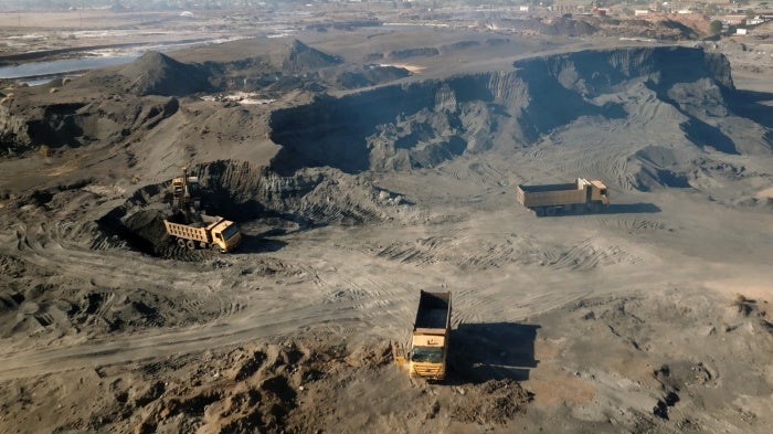 Trucks removing lead waste