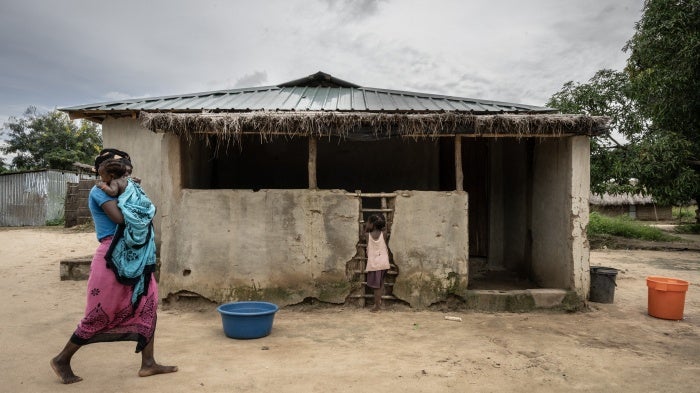 A mother walks with her daughters in the community of Saul, in the Metuge region of Cabo Delgado province, Mozambique, on March 26, 2024.