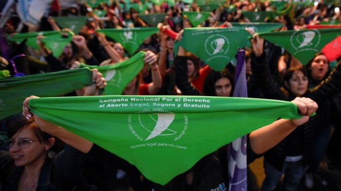 People hold green handkerchiefs during a demonstration in support of safe and legal abortion access to mark International Safe Abortion Day, in Buenos Aires, Argentina, September 28, 2023.