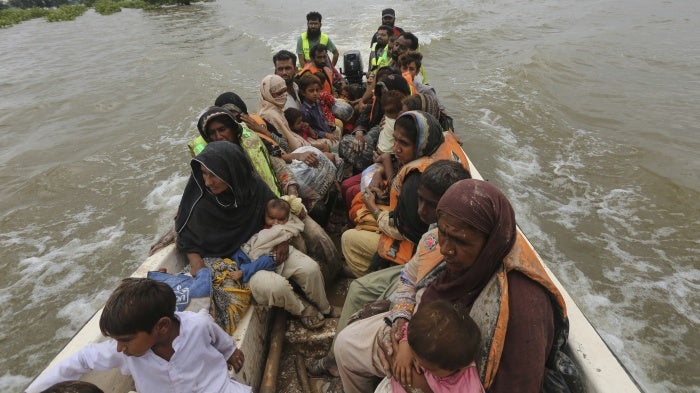 Rescue workers evacuate villagers from a flooded area in Jalalpur Pirwala, Multan district, Pakistan, September 8, 2025. 