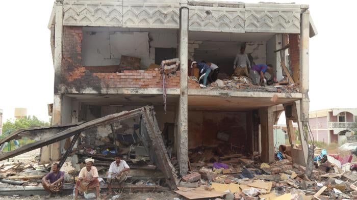 Men dig through rubble at a residential compound housing employees of the Mokha Steam Power Plant and their families that was struck by six bombs dropped by warplanes of the Saudi-led coalition, killing 57 people in Mokha, Yemen on July 24, 2015. 