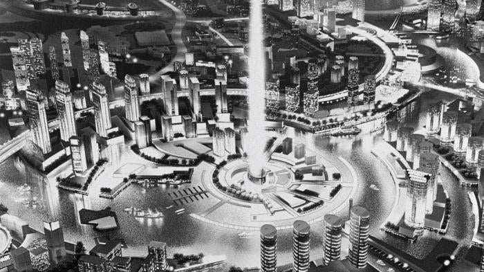 A foreign domestic worker with a child under a billboard in Dubai, the United Arab Emirates.