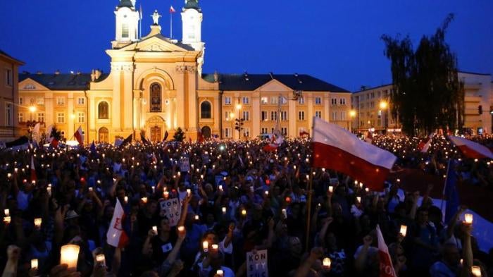 People gather in front of the Supreme Court during a protest against the Supreme Court legislation in Warsaw, Poland, July 22, 2017. 
