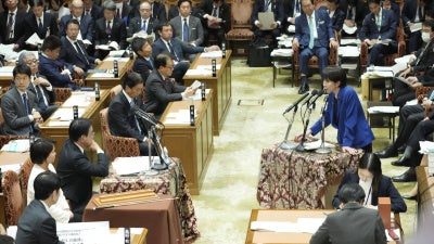 Japanese Prime Minister Sanae Takaichi (R) answers questions from the House of Representatives budget committee in Tokyo, November 7, 2025. 