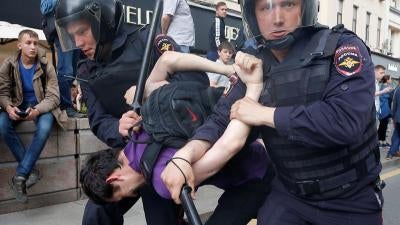 Riot police detain a man during an anti-corruption protest organised by opposition leader Alexei Navalny, on Tverskaya Street in central Moscow, Russia, June 12, 2017. 