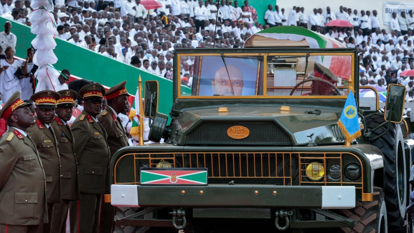 A portrait of Burundi's late president Pierre Nkurunziza sits in the front seat of the military vehicle carrying his coffin at his state funeral in Gitega, Burundi, June 26, 2020.