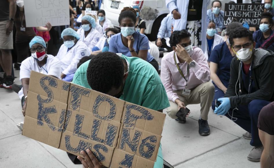 Healthcare workers at Brooklyn's Kings County Hospital show their solidarity with the Black Lives Matter movement during the coronavirus pandemic, New York, June 4, 2020.