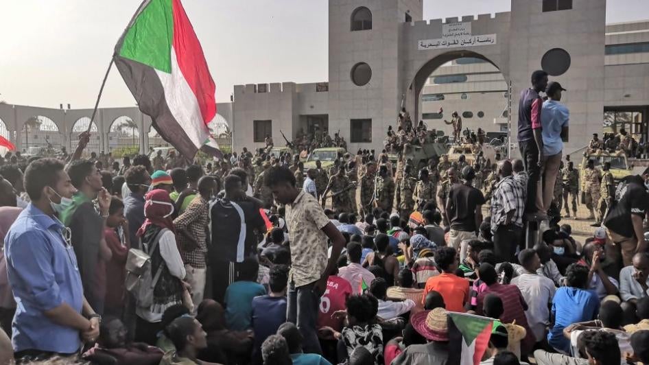 Sudanese soldiers stand guard as demonstrators rally near the army headquarters in the Sudanese capital Khartoum, April 11, 2019.