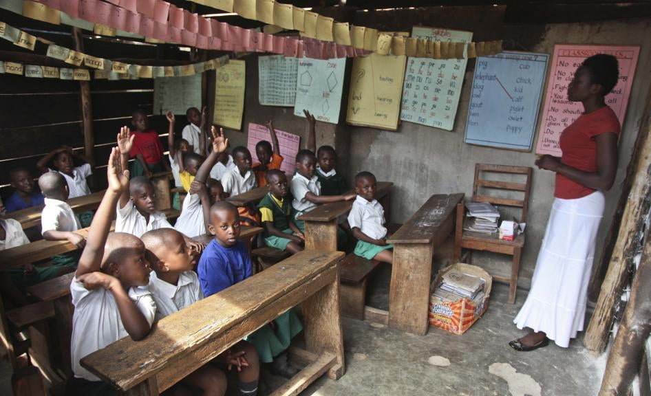Pupils sit in a classroom at the Kibuye Junior Primary School in the Katwe slum of Kampala, Uganda, October 14, 2016.