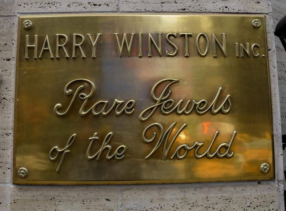 A gold plaque that reads "Harry Winston Inc.: Rare Jewels of the World"