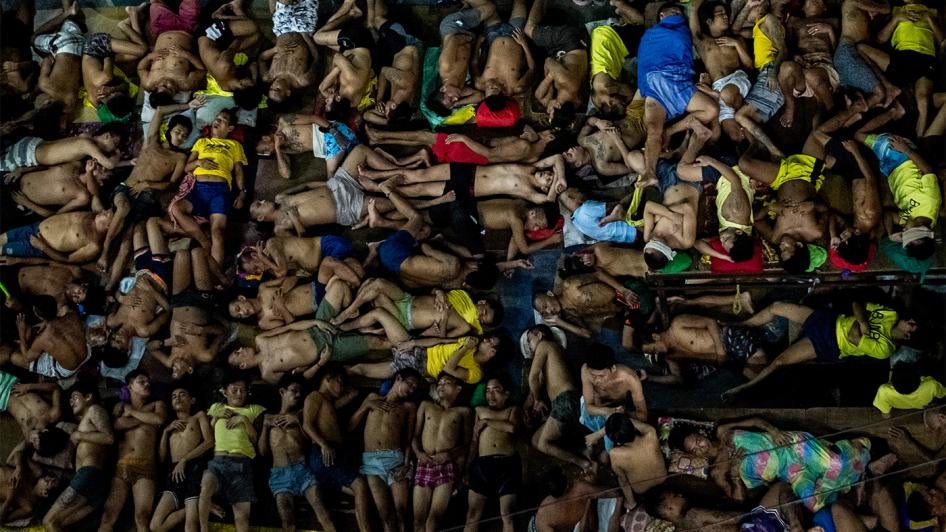 Detainees sleep in an open basketball court inside the Quezon City Jail in Quezon City, Philippines on July 24, 2020. 