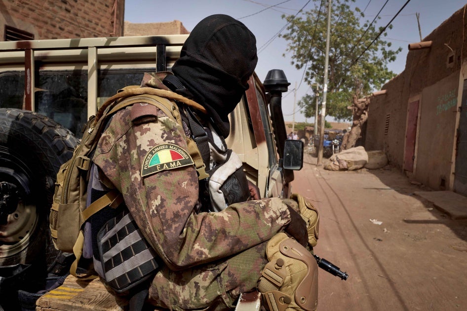 A member of the Malian Armed Forces (FAMA) patrols a road in central Mali, February 2020.