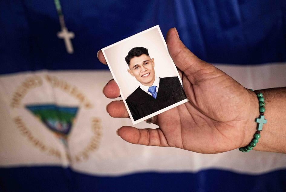 Lesbia Alfaro, mother of student leader Lester Alemán, who went into exile after participating in protests against Nicaraguan President Daniel Ortega's government in 2018, holds a portrait of her son during an interview with AFP in Managua, on September 14, 2021.