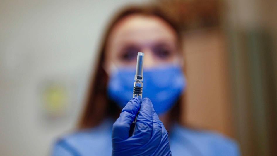 A health worker displays a dose of a Covid-19 vaccine in Istanbul, Turkey on October 9, 2020.