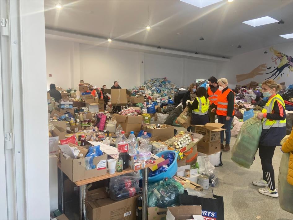 People put aid items into boxes