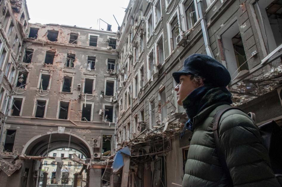A local resident looks at his house destroyed in a Russian air raid in Kharkiv, Ukraine, March 3, 2022.