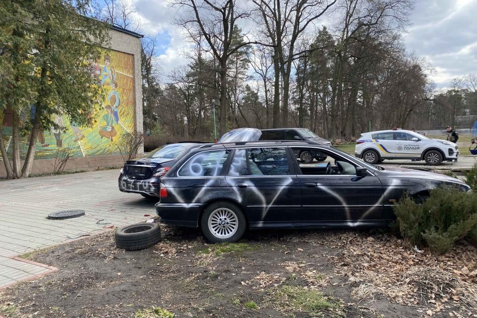 Private vehicles with “V”s spray-painted on their exteriors