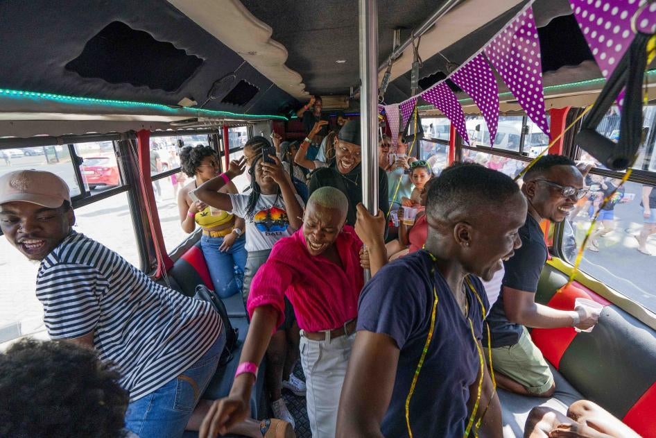 People on a bus among the thousands participating in the 30th Gay Pride event in Johannesburg, South Africa, October 26, 2019. ©2019 AP Photo/Jerome Delay