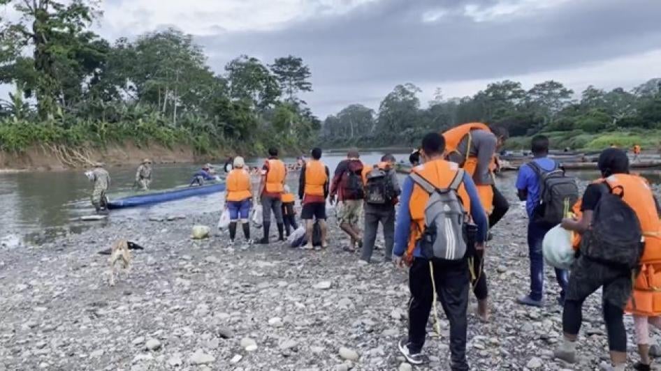 Migrants waiting for a boat to take them from the Indigenous community of Canaán Mebrillo to Puerto Limón, Panama, after a days-long walk across de Darien Gap, May 2022.