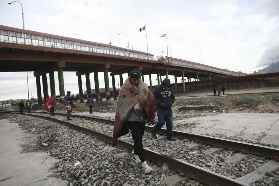 Venezuelans walk near a bridge that crosses the Rio Grande River after being expelled from the United States into Ciudad Juarez, Mexico, Tuesday, Oct. 18, 2022. The Biden administration announced on Oct. 12, that Venezuelans who cross the border irregularly will be immediately expelled to Mexico without being allowed to seek asylum.