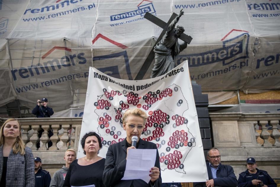 Joanna Scheuring-Wielgus, a social activist and politician, reads testimony from a child who was molested by a priest during a protest in Warsaw, October 7, 2018.