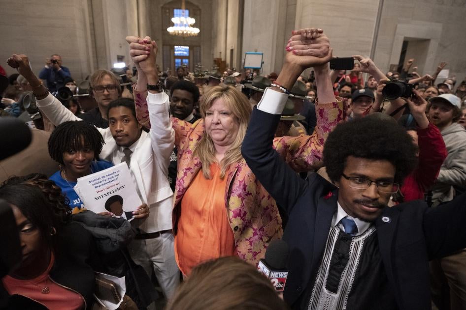 Former Rep. Justin Jones, D-Nashville, Rep. Gloria Johnson, D-Knoxville, and former Rep. Justin Pearson, D-Memphis, raise their hands outside the House chamber after Jones and Pearson were expelled from the legislature April 6, 2023.