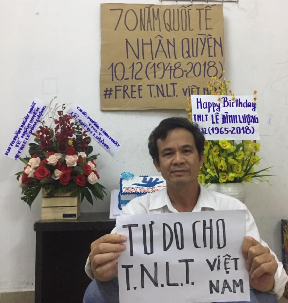 Tran Van Bang holds a sign that says “Freedom for Vietnamese Prisoners of Conscience” to celebrate the 70th anniversary of the Universal Declaration of Human Rights.
