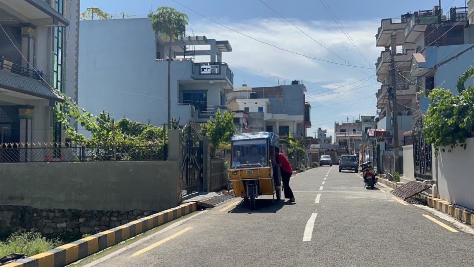 Til and his wife Chitrakala head to the hospital in an auto rickshaw, Butwal, Nepal, July 22, 2023. 
