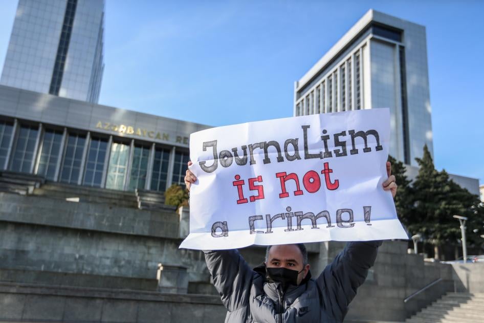 Ulvi Hasanli, director of "Abzas Media" online publication is seen during a rally of journalists against a new media bill, in front of the Parliament building in Baku, Azerbaijan, December 28, 2021. 