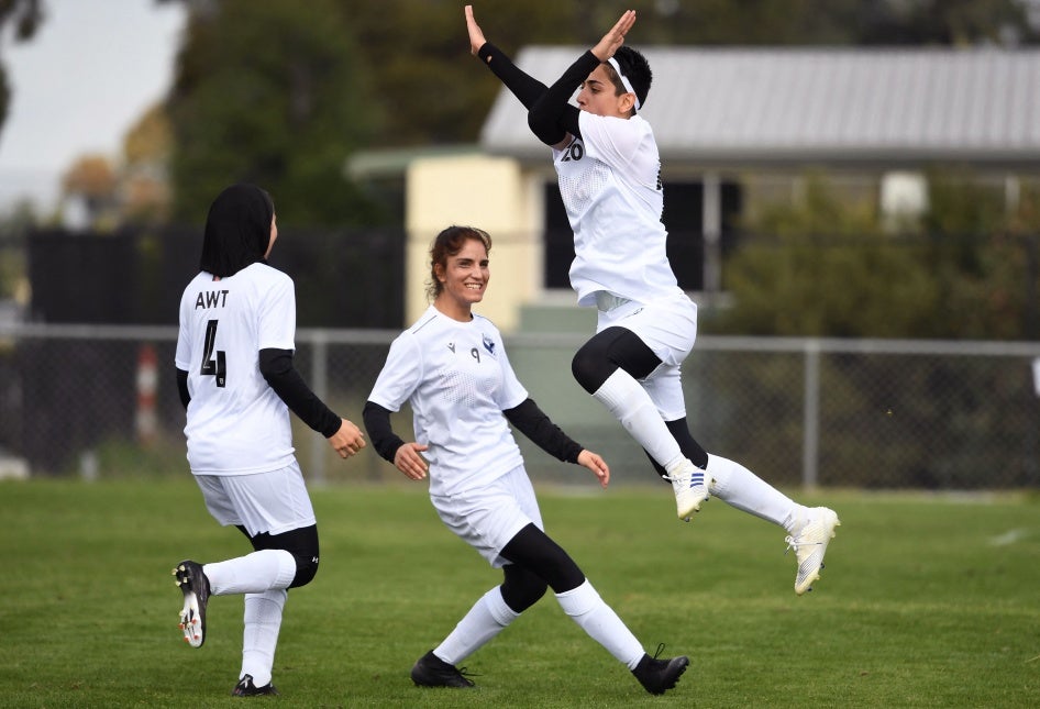 Afghan women's football team players celebrate a goal on April 24, 2022.