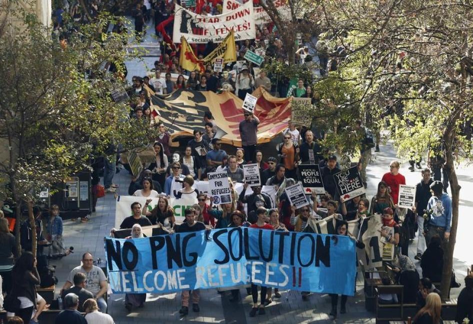 Hundreds of demonstrators march through Pitt street during a rally in support of asylum seekers in central Sydney August 10, 2013.