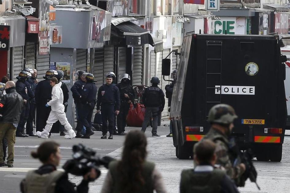 Members of special French RAID forces, French riot police (CRS), soldiers and forensic experts are seen at a raid zone in Saint-Denis, near Paris, France, in this November 18, 2015 file photo.