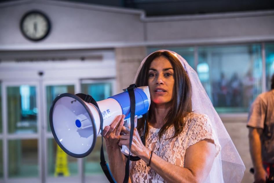 Sonia Ossorio of NOW-NYC addresses the crowd at a protest against US laws allowing child marriage.