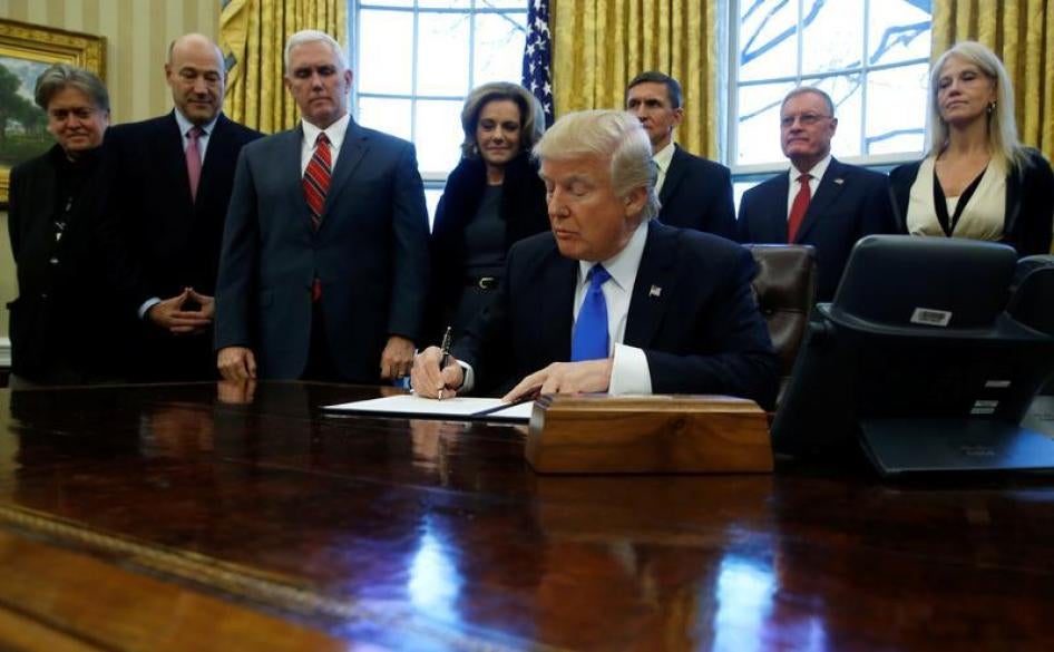 U.S. President Donald Trump signs a memorandum to security services directing them to defeat the Islamic State in the Oval Office at the White House in Washington, U.S. January 28, 2017.