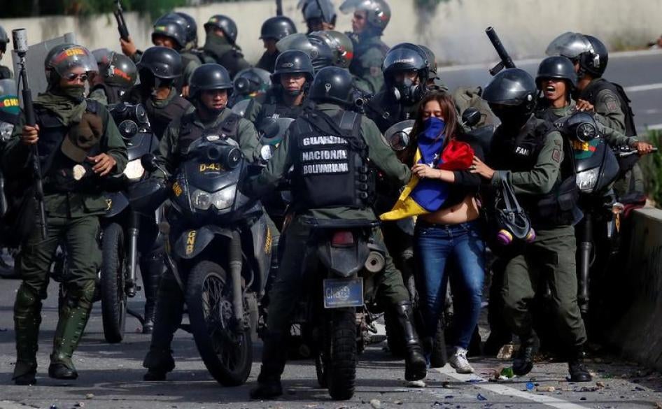 A demonstrator is detained by security forces during a protest against Venezuelan President Nicolas Maduro's government in Caracas, Venezuela, July 10, 2017.
