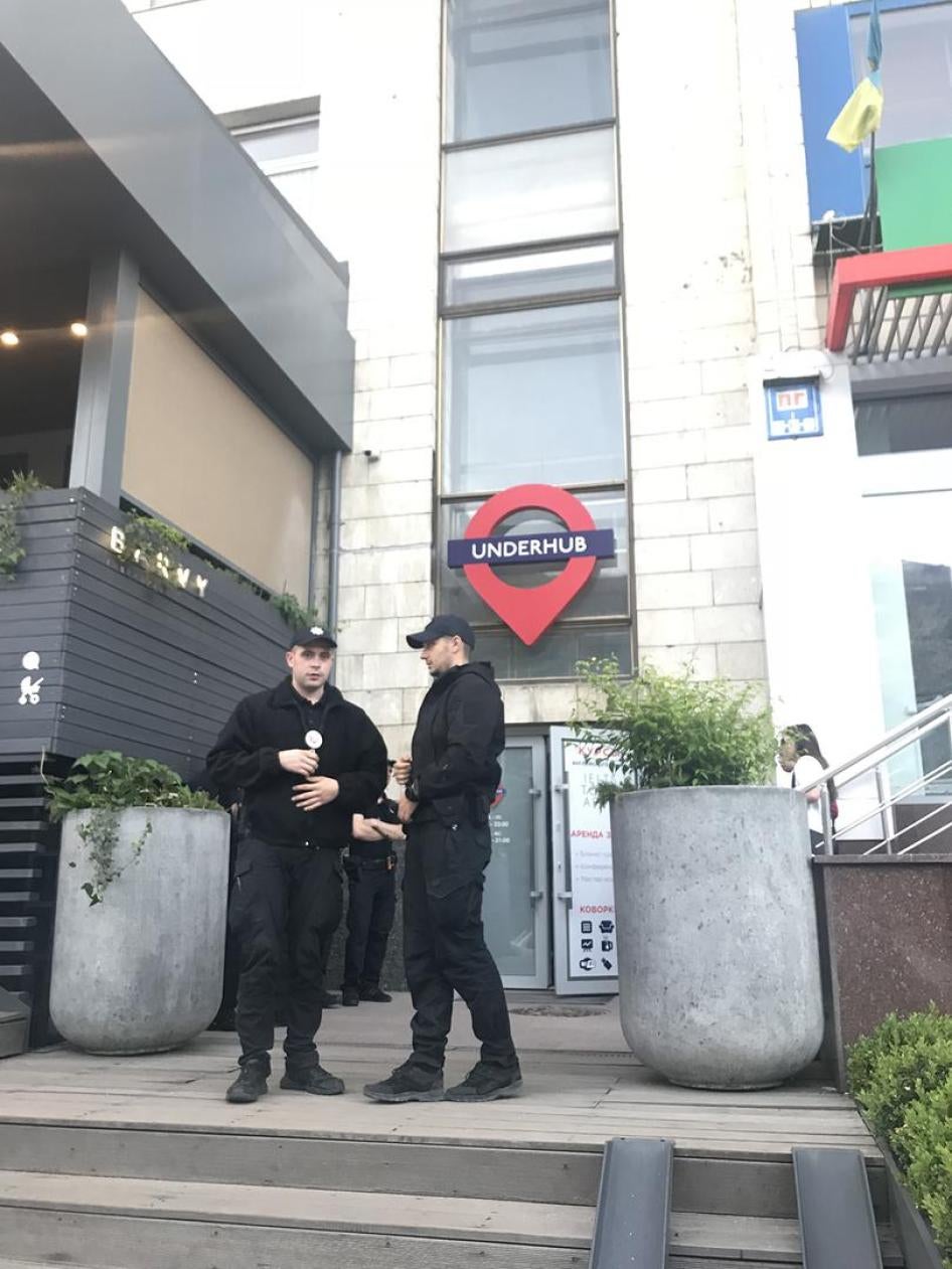 Kyiv police waiting outside the venue where an Amnesty International event was disrupted by members of radical groups.