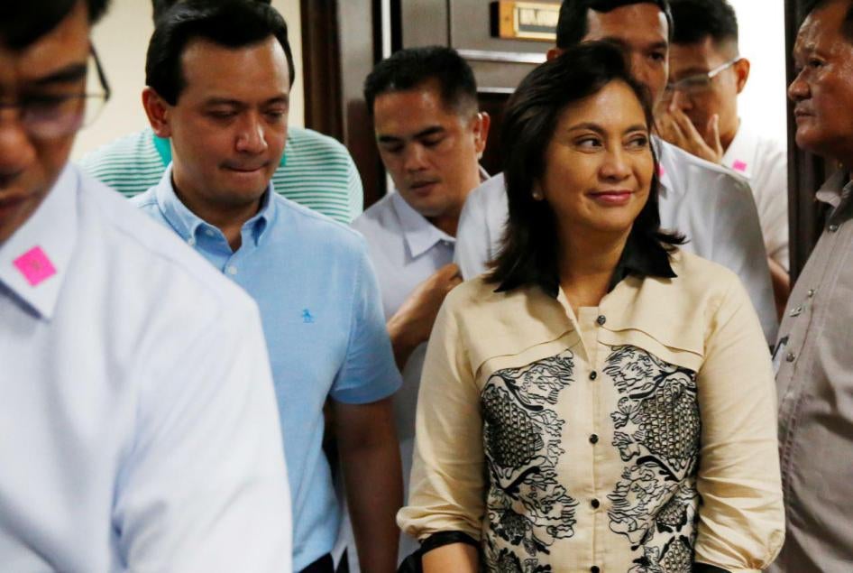 Sen. Antonio Trillanes IV, second left, escorts Vice President Leni Robredo, right, who visited him at the Philippine Senate Thursday, Sept. 6, 2018 in suburban Pasay city, south of Manila, Philippines. 