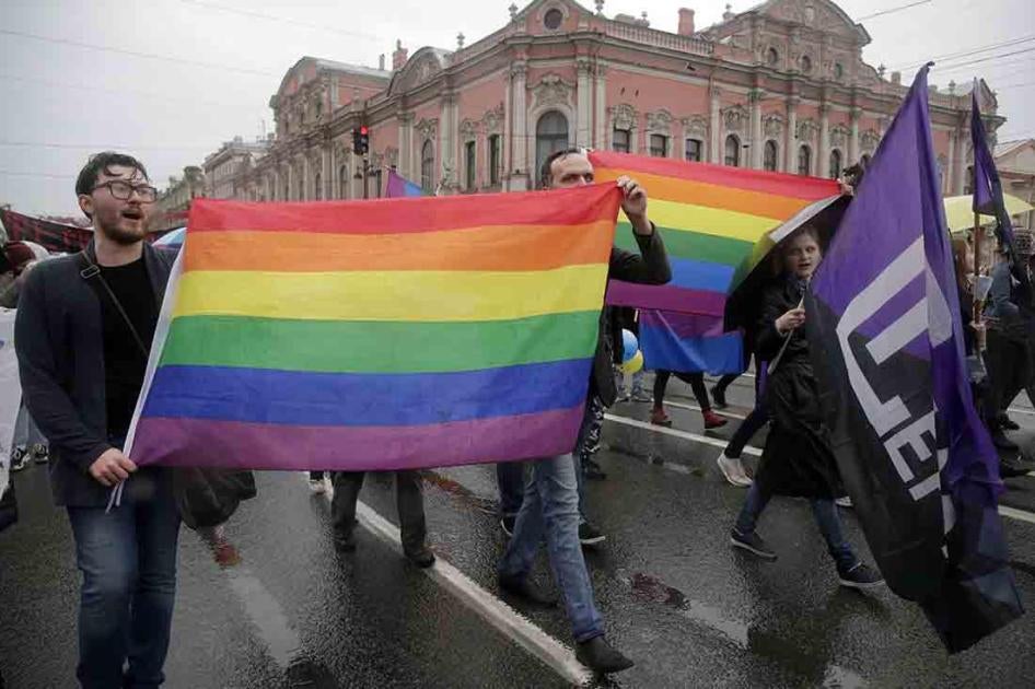 LGBT rights activists carry the rainbow flag during a May Day rally in St. Petersburg, Russia.