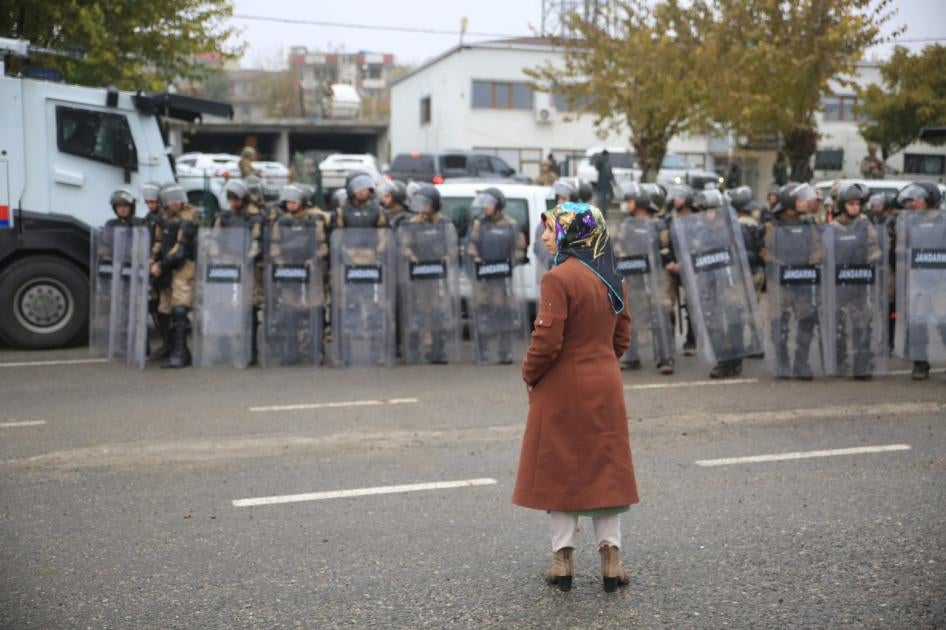 İkiköprü co-mayor Hatice Taş is blocked from entering the municipality building by police after the Interior Ministry removed her and the other co-mayor Osman Karabulut and appointed a state-appointed trustee as a replacement in İkiköprü town, Batman prov