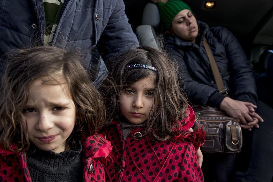  Two young Iranian sisters at the Idomeni border crossing between Greece and Macedonia.  January 26, 2016.