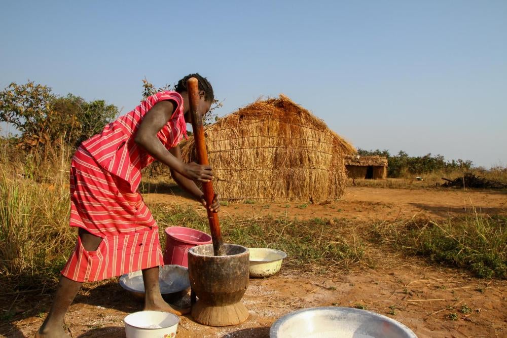 A displaced girl from Boumari prepares food outside her family’s makeshift hut near the village of Bodé on November 23, 2016. Attacks by the 3R rebel group have forced at least 17,000 people from their homes in the Central African Republic.