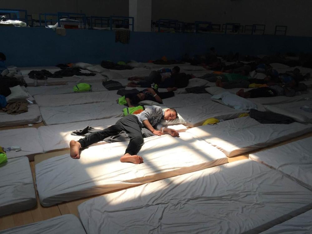 A young Egyptian man in the main room at the Pozzallo “hotspot” on June 9, 2016. The center was at double capacity and held 185 unaccompanied children. 